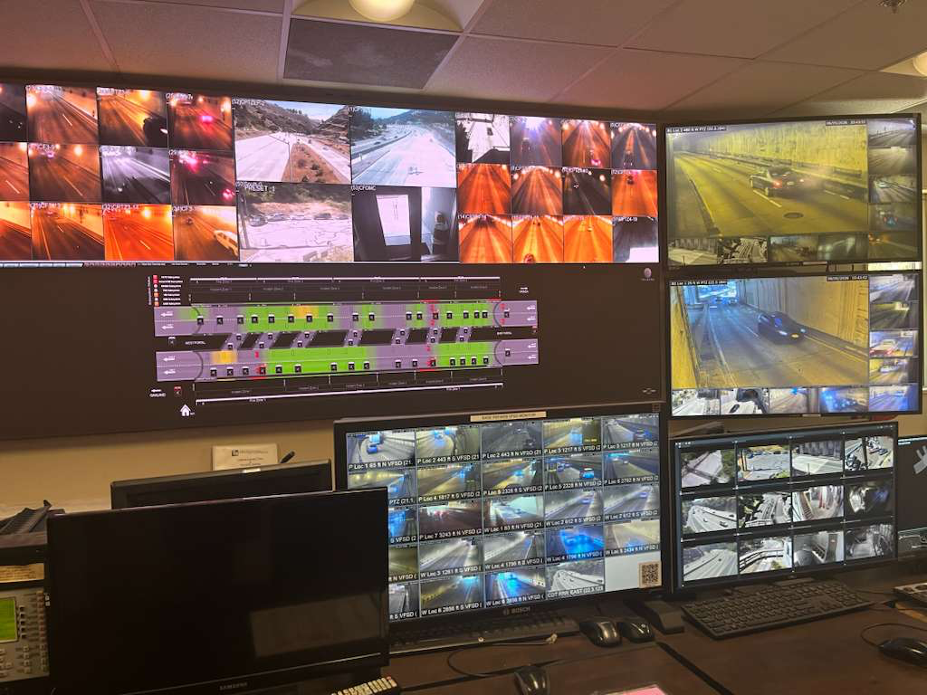 A wall of screens for monitoring the tunnel.