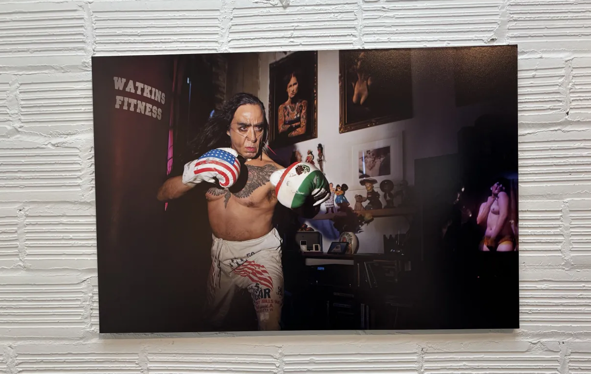 image of GP sparring near a punching bag with a Mexican flag