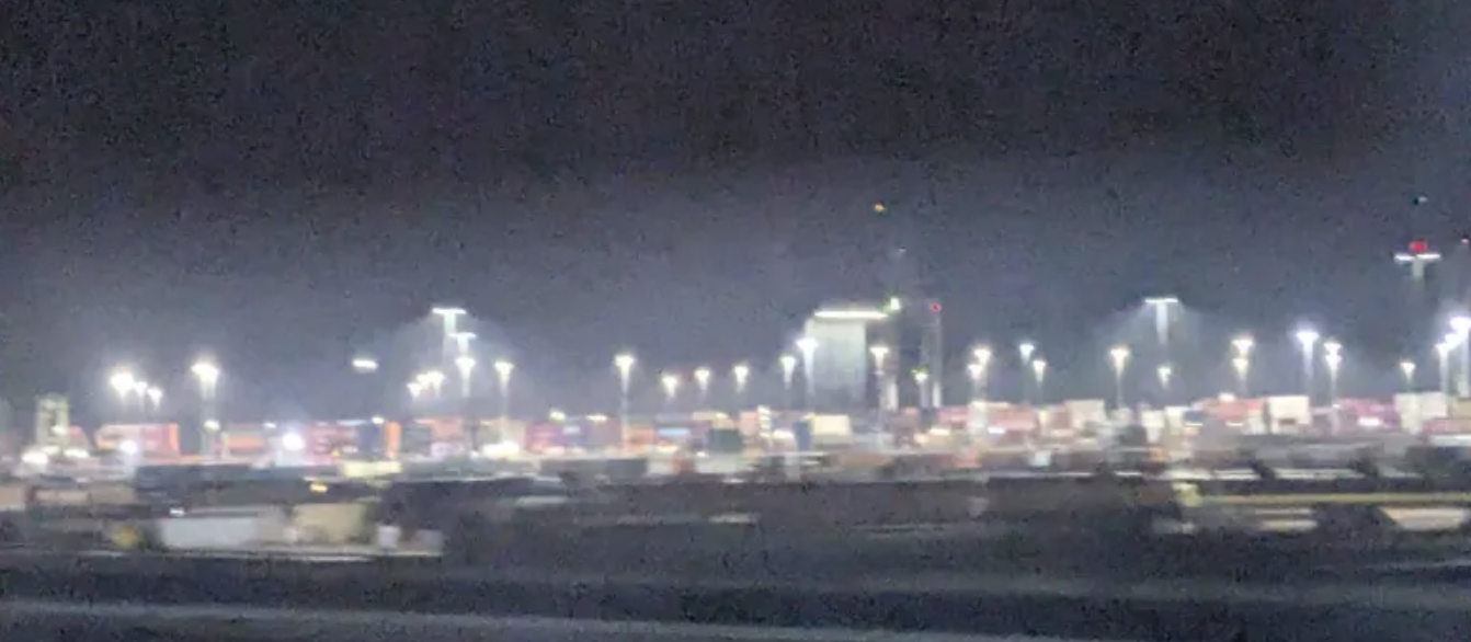 some grainy images of lights, probably the port? hard to say