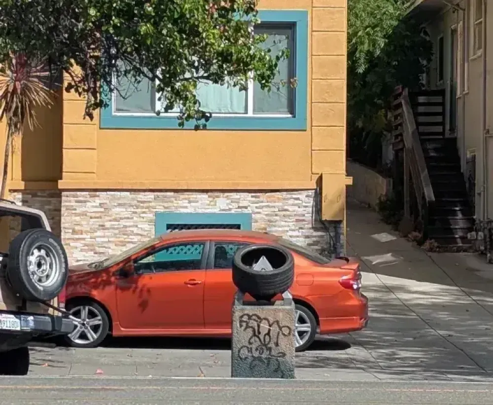 A garbage can with a tire on top, for some reason.