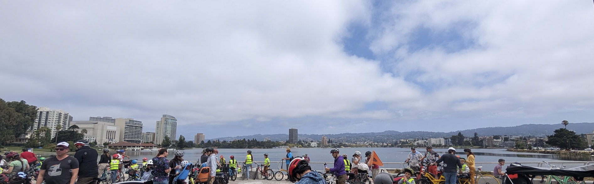 Sky above Lake Merritt and the heads of bikers.