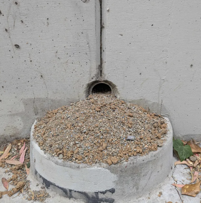 A sandy exhaust pipe dump.