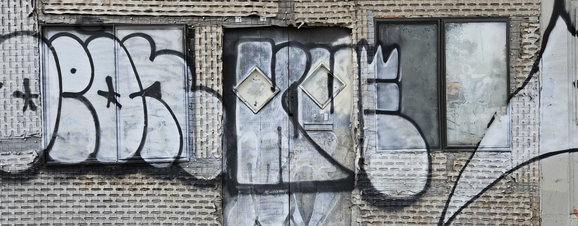 A wash of graffiti grey exterior of a building.