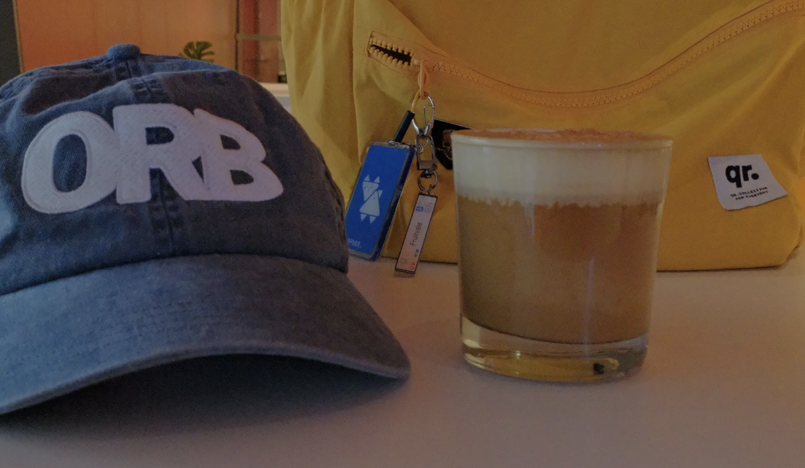 An orb hat and a drink.