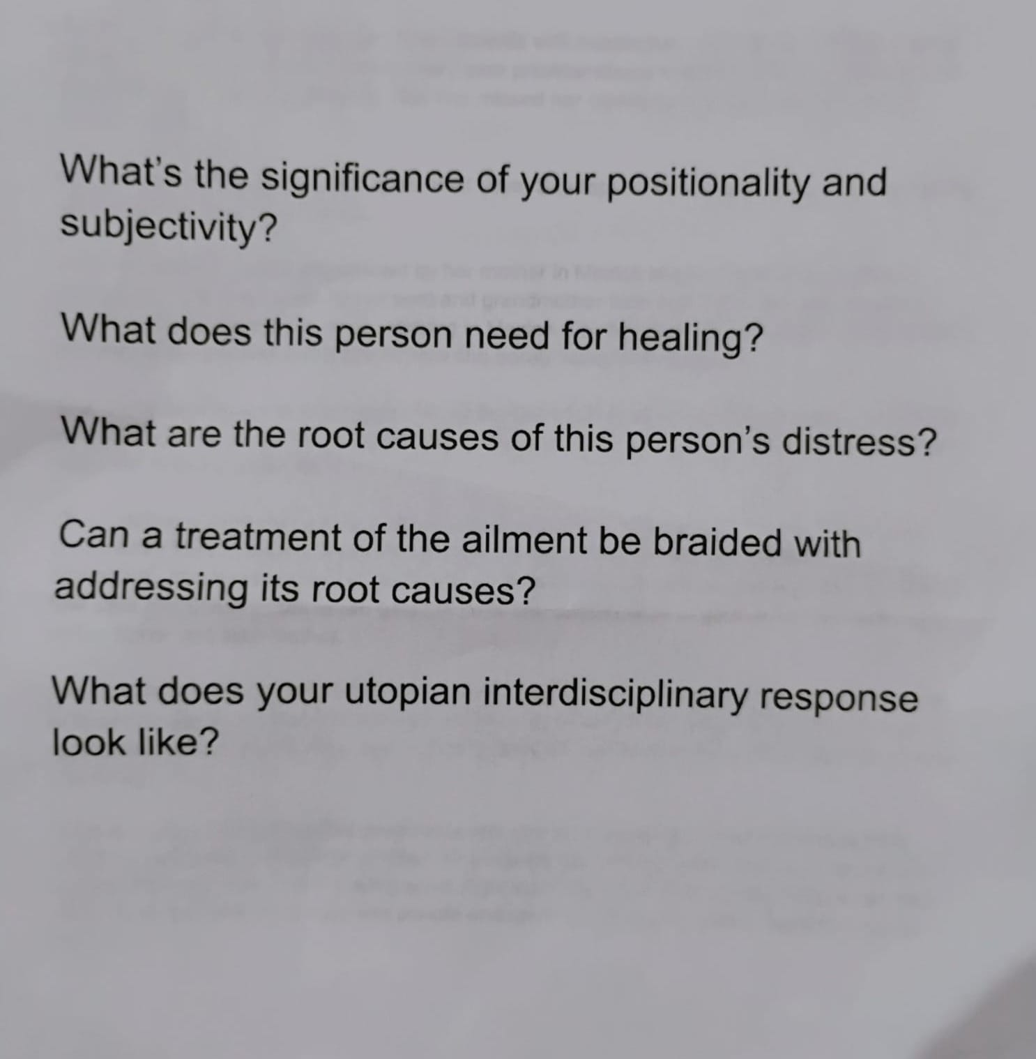 A document from the workshop, with five questions on it. The first: "What's the significance of your positionality and subjectivity?" The second: "What does this person need for healing?"