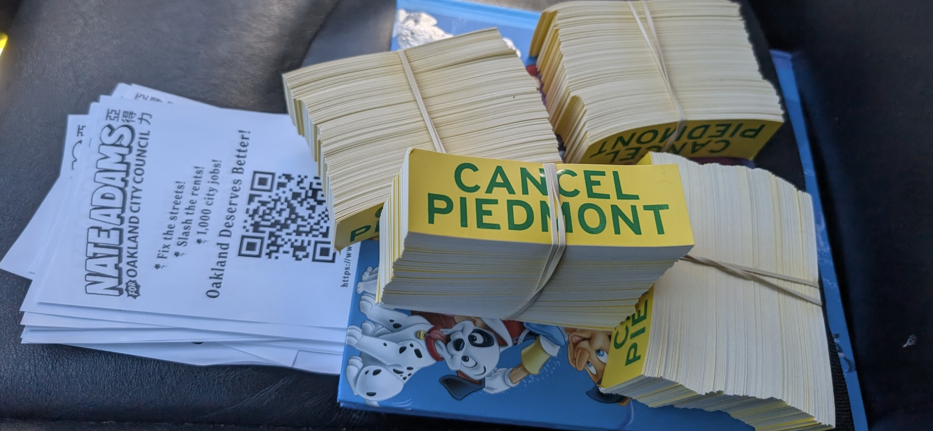 Stickers and fliers on a car seat.