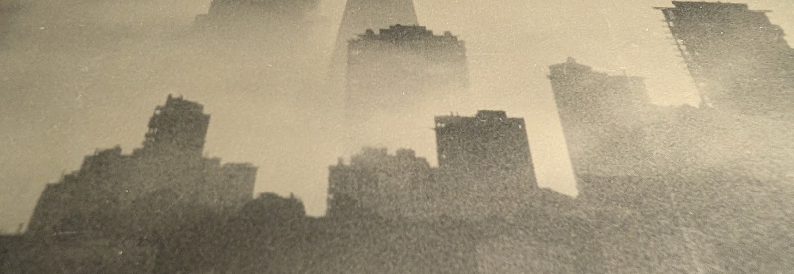 A foggy image of the West Bay skyline.