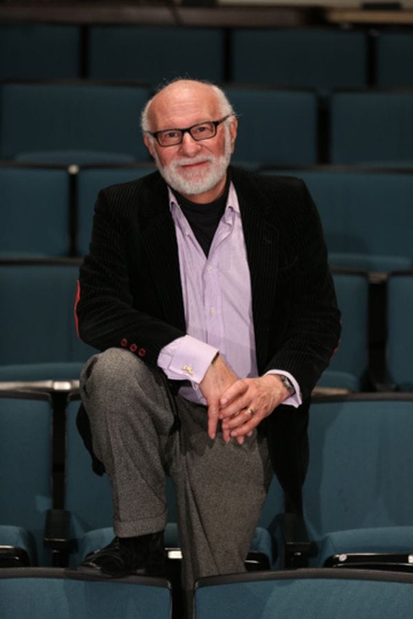 Peter LeDonne seated in an empty theatre