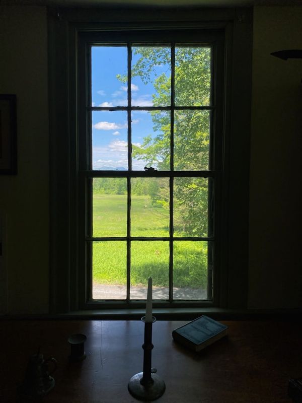 Window from writing desk at Herman Melville House, overlooking field where Hedy and Julee are walking the grounds of Arrowhead in Pittsfield, Massachusetts