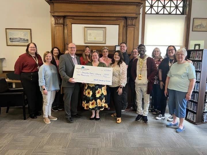 Library Celebrates $1,000 Boost from Chamber, Citizens Surprised