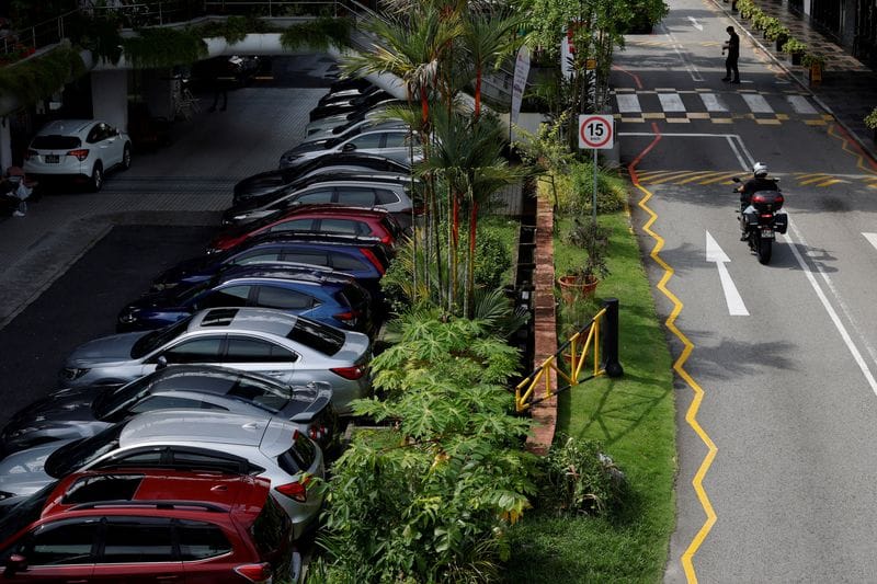 FILE PHOTO: Cars for sale are parked at used car dealerships in Singapore