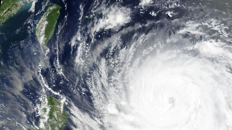 A satellite image shows Typhoon Bavi as it churns in the Pacific Ocean