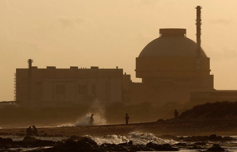 FILE PHOTO: Police patrol on a beach near Kudankulam nuclear power project in the southern Indian state of Tamil Nadu