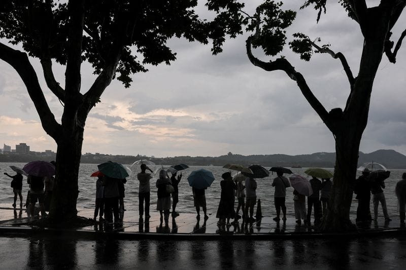 People use umbrellas in the rain in Hangzhou