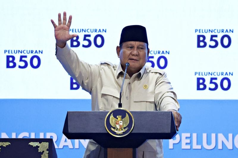 Indonesian President Prabowo Subianto gestures during a ceremony,