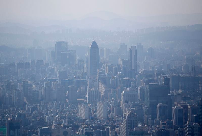 FILE PHOTO: The skyline of central Seoul is seen during a foggy day in Seoul