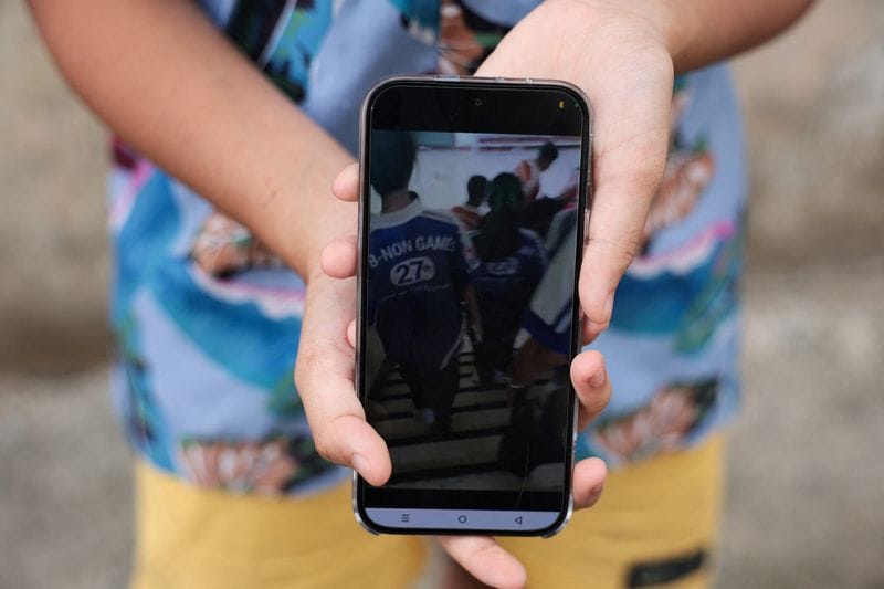 Khim, a student at Debsirin Nonthaburi School, shows footage she recorded during evacuation, during an exclusive interview with Reuters
