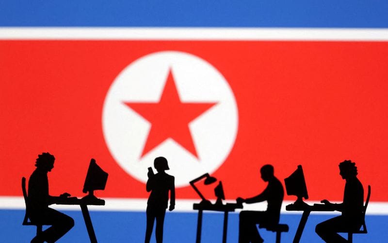 FILE PHOTO: Illustration shows miniatures and North Korea flag