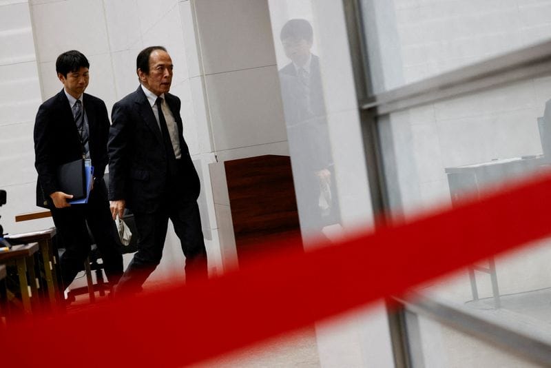 FILE PHOTO: Bank of Japan Governor Kazuo Ueda attends a press conference after a policy meeting in Tokyo