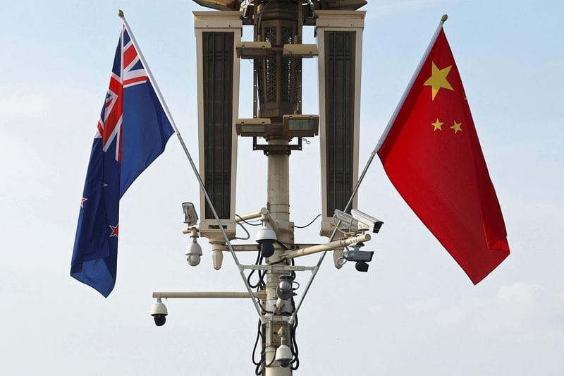 Flags of New Zealand and China flutter in Beijing
