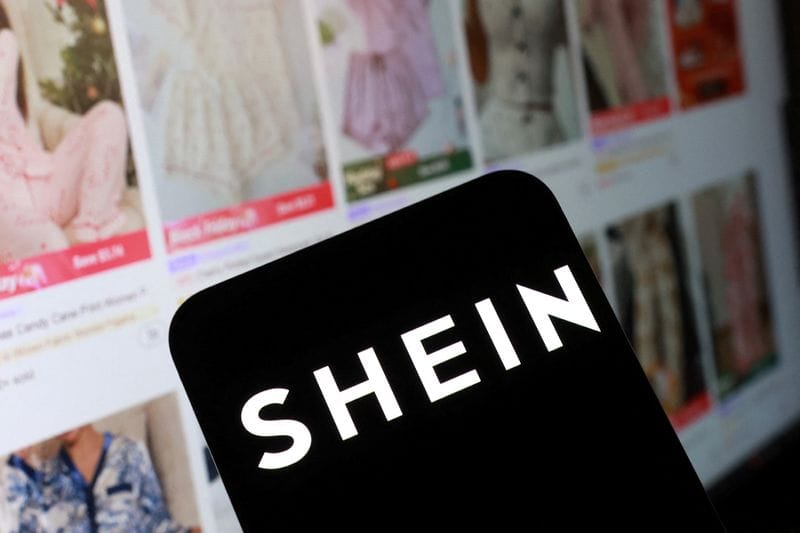 Illustration shows Shein logo and their web page
