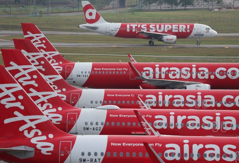 FILE PHOTO: AirAsia planes stand on the tarmac at Kuala Lumpur International Airport Terminal 2 (KLIA2) in Sepang