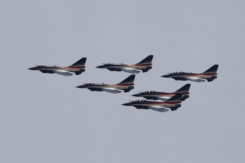 J-10 fighter jets from the Chinese military aerobatics team perform during a rehearsal, ahead of the Pakistan Day military parade in Islamabad