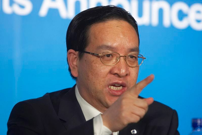 Chairman of Bank of Communications Jiang Chaoliang releases the company's annual results at a news conference in Hong Kong