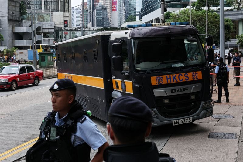A prison van, believed to be carrying jailed pro-democracy activist Joshua Wong, arrives at the High Court for a national security plea and sentencing hearing, in Hong Kong