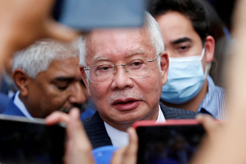 FILE PHOTO: Former Malaysian Prime Minister Najib Razak speaks to journalists outside the Federal Court during a court break, in Putrajaya