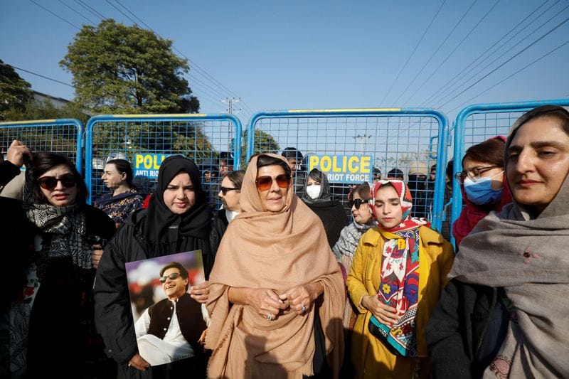 Supporters of jailed former Prime Minister of Pakistan Imran Khan, protest on a road leading to Adiala jail in Rawalpindi