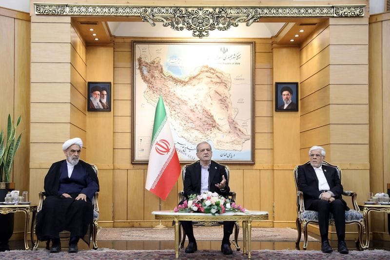 Iranian President Masoud Pezeshkian speaks before departing for New York, at Mehrabad Airport in Tehran