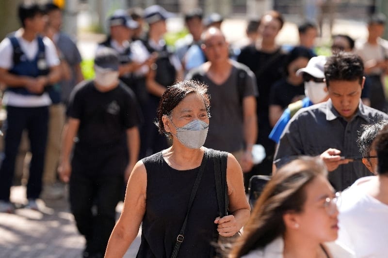 Activist Chan Po-ying arrives at West Kowloon Law Courts Building ahead of the sentencing of former leaders of the disbanded Hong Kong Alliance in Support of Patriotic Democratic Movements of China, which organised annual Tiananmen Square vigils, in