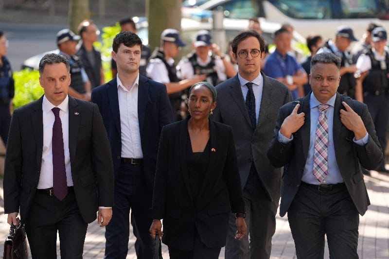 Consular representatives arrive at West Kowloon Law Courts Building ahead of the sentencing of former leaders of the disbanded Hong Kong Alliance in Support of Patriotic Democratic Movements of China, which organised annual Tiananmen Square vigils, i