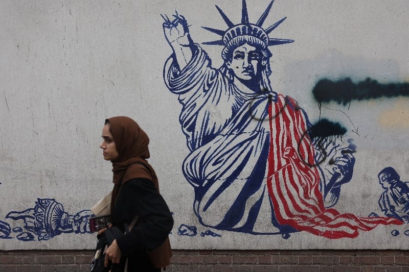 A woman walks near an anti-U.S. mural in Tehran, Iran, September 9, 2026. Majid Asgaripour/WANA (West Asia News Agency) via REUTERS REUTERS/Majid Asgaripour