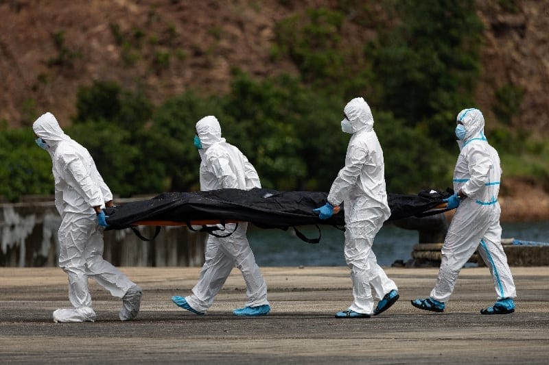 Members of the Philippine Coast Guard carry body bags containing the recovered remains of victims of a fire aboard the MV June Aster ferry off the coast of Palawan, in Coron, Philippines, September 13, 2026. REUTERS/Eloisa Lopez