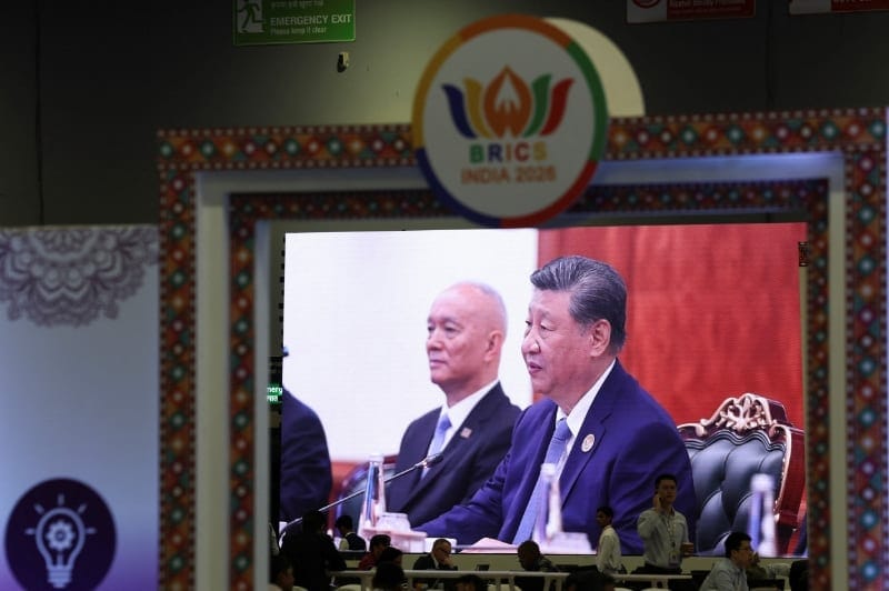 A screen displayed at the international media centre shows Chinese President Xi Jinping attending the BRICS Summit at Bharat Mandapam in New Delhi, India, September 13, 2026. REUTERS/Bhawika Chhabra
