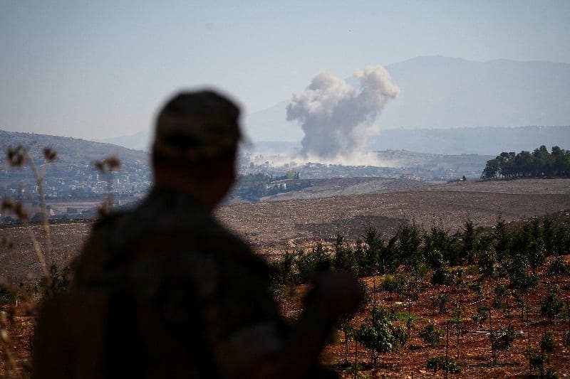 Smoke rises in southern Lebanon following an Israeli strike, as seen from Zawtar al-Gharbiyeh, southern Lebanon, September 13, 2026. REUTERS/Stringer