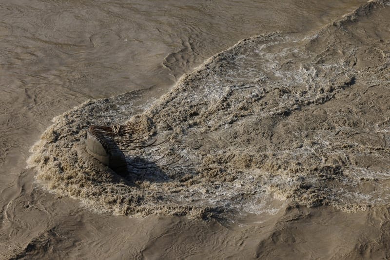 Water flows past the remains of a bridge pier after the structure was washed away by deadly flash floods and a mudslide, in Dhading district, Nepal, September 14, 2026. REUTERS/Tyrone Siu