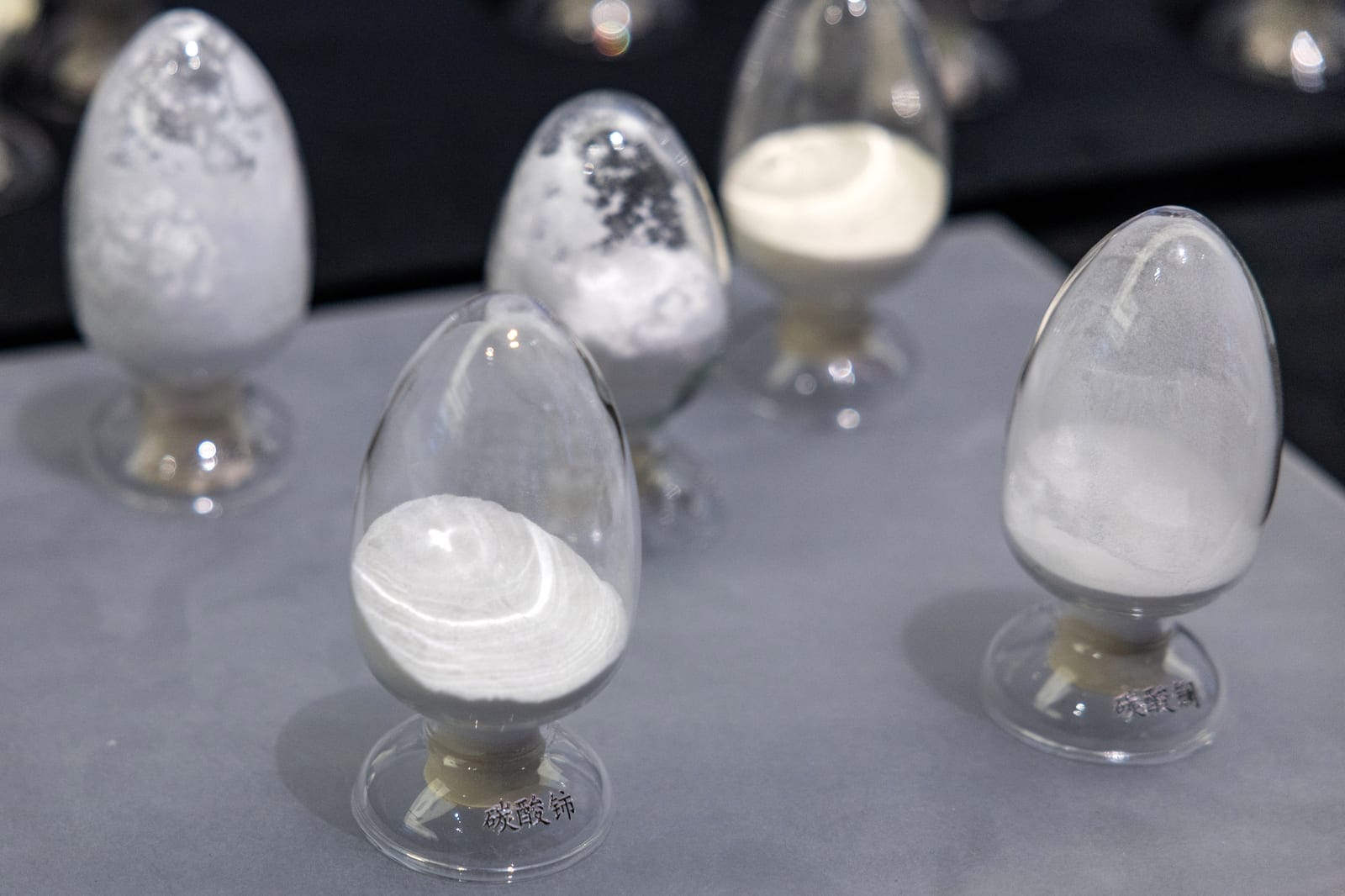 A sample of cerium carbonate and other materials sits on display in a section devoted to rare earth elements production at the exhibition on China’s manufacturing achievements, at the National Museum in Beijing, China, March 24, 2026. REUTERS/Maxim S