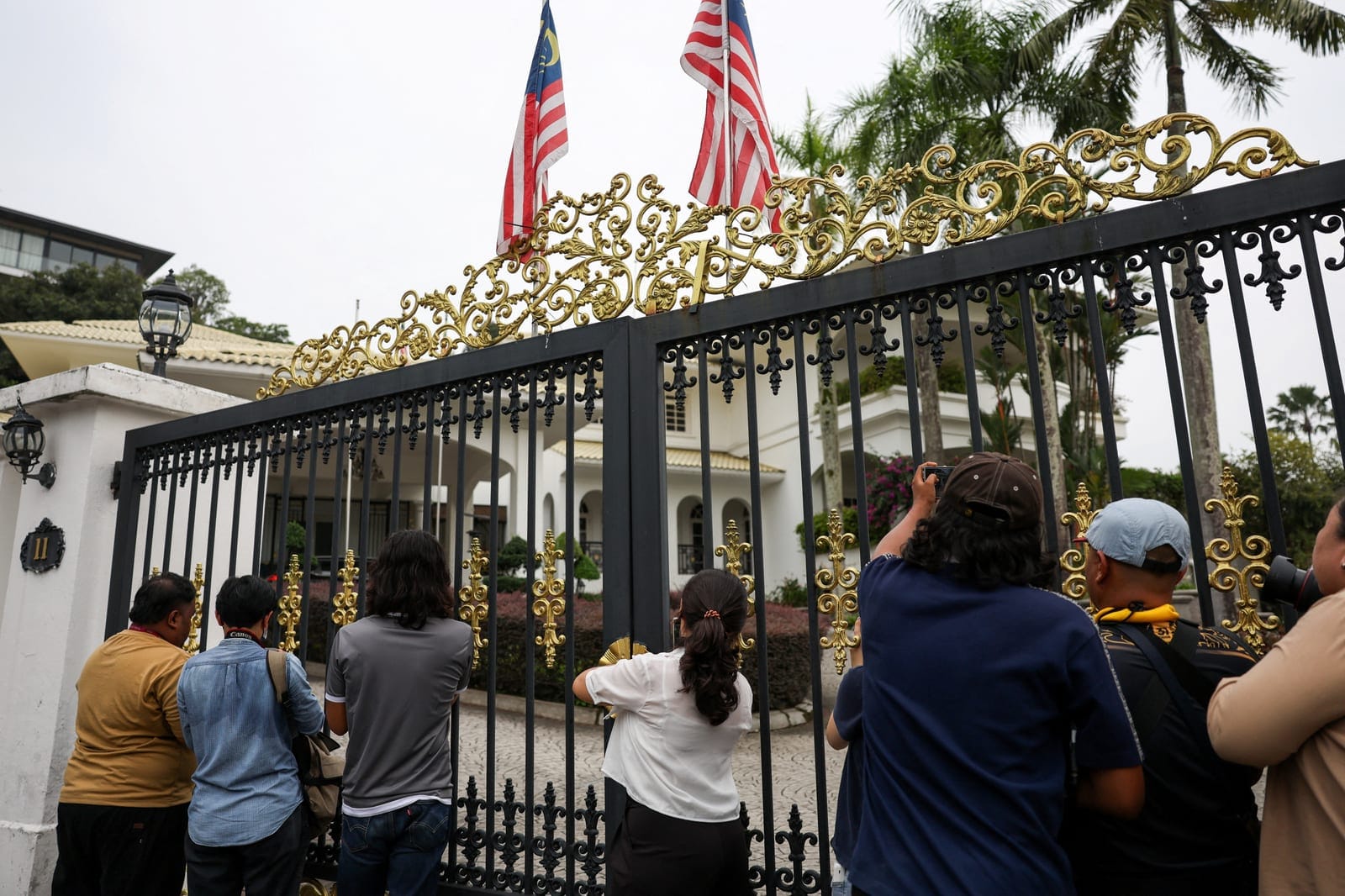 Members of the media outside former Malaysian Prime Minister Najib Razak's house as Malaysia's King agreed to allow the jailed former prime minister to serve the remainder of his sentence under house arrest, in Kuala Lumpur, Malaysia, September 18, 2