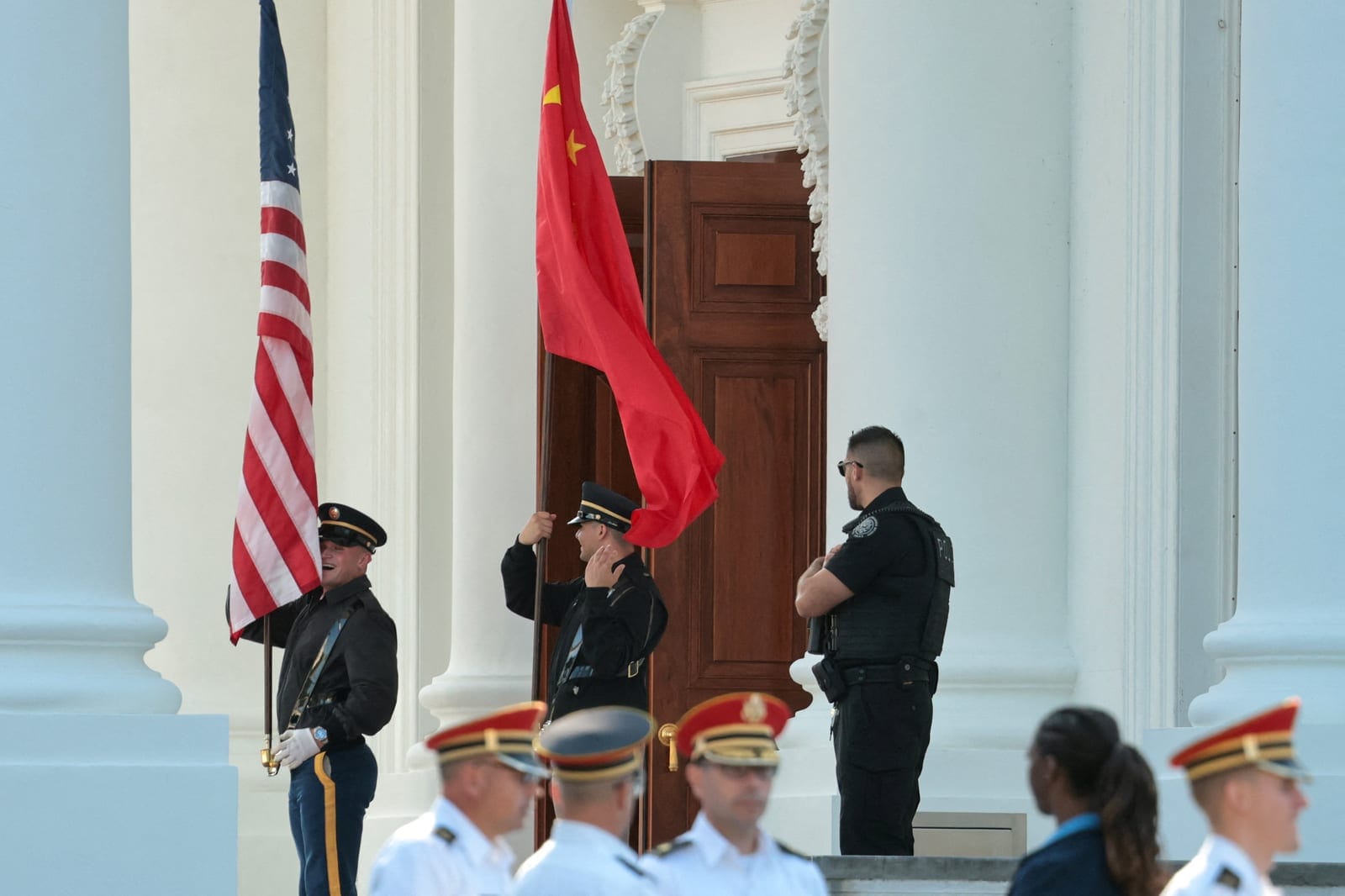 Members of a U.S. military honor guard rehearse an arrival ceremony with a Chinese flag and U.S. flag ahead of Chinese President Xi Jinping’s state visit next week with U.S. President Donald Trump at the White House in Washington, D.C., U.S., Septemb