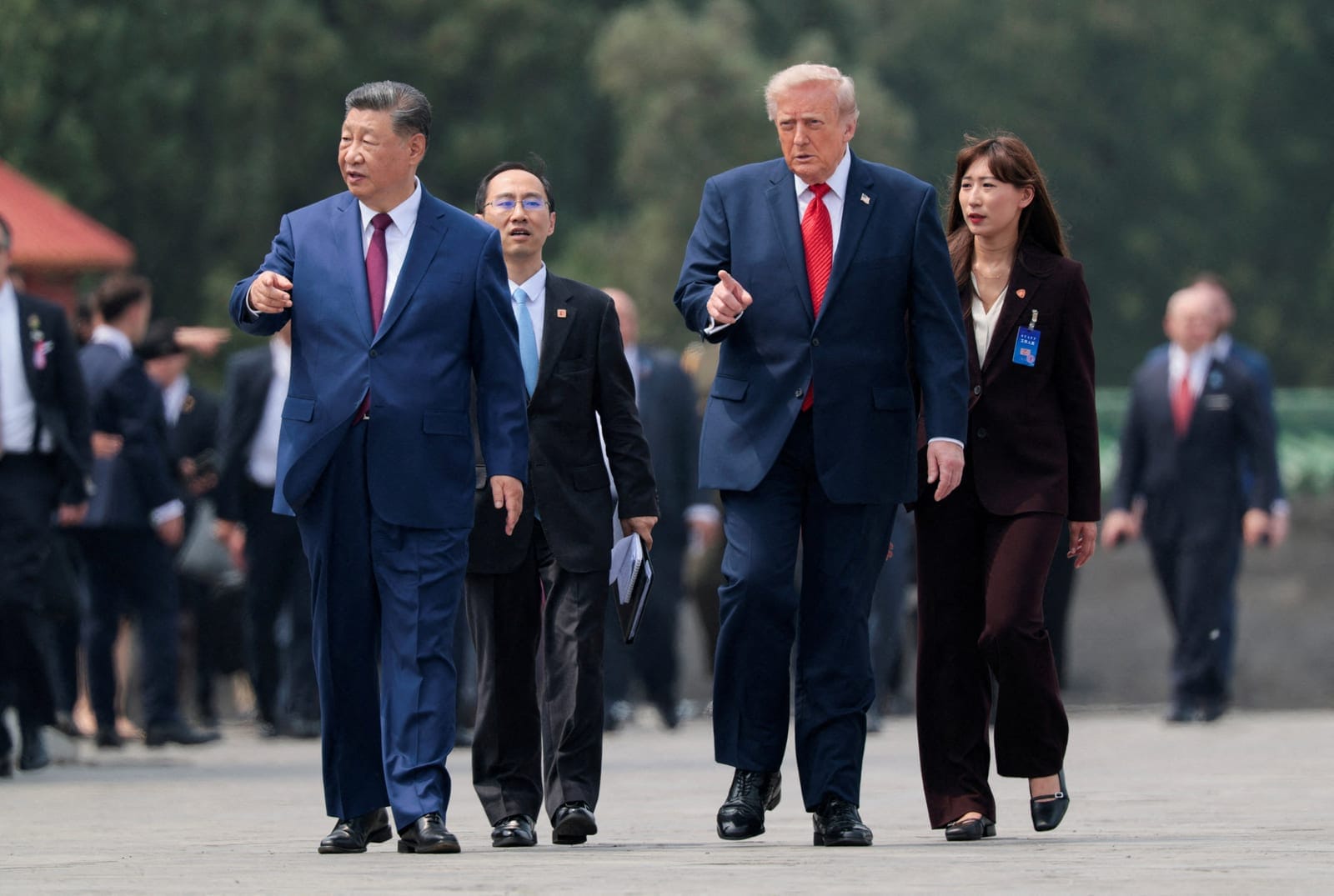 FILE PHOTO: U.S. President Donald Trump and Chinese President Xi Jinping walk together as they tour the Temple of Heaven in Beijing, China, May 14, 2026. REUTERS/Evan Vucci/File Photo