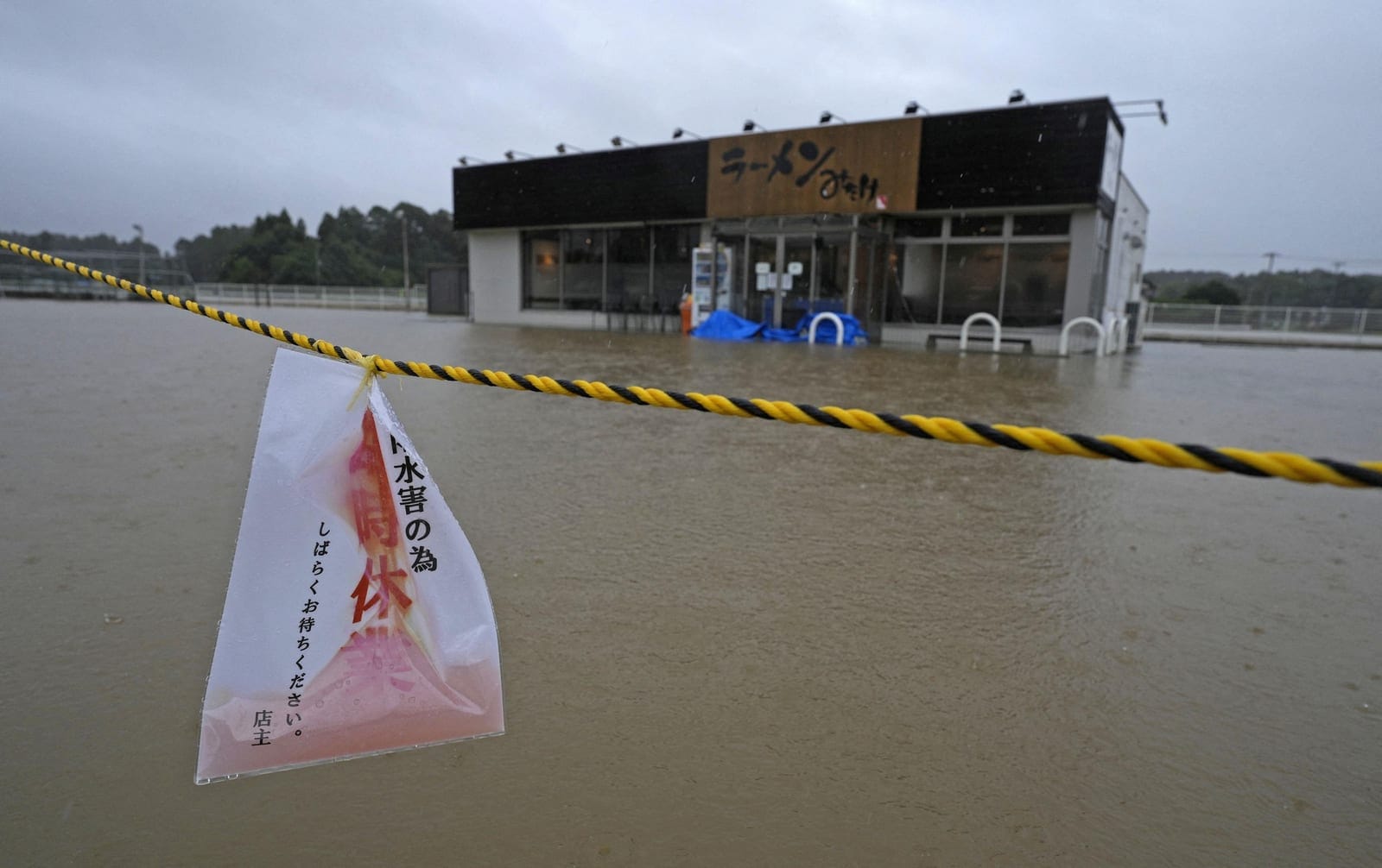 The area around a ramen restaurant is flooded by heavy rain as Typhoon Dujuan approaches, in Oamishirasato, Chiba Prefecture, Japan, September 21, 2026 in this photo taken by Kyodo. Kyodo/via REUTERS REUTERS/KYODO