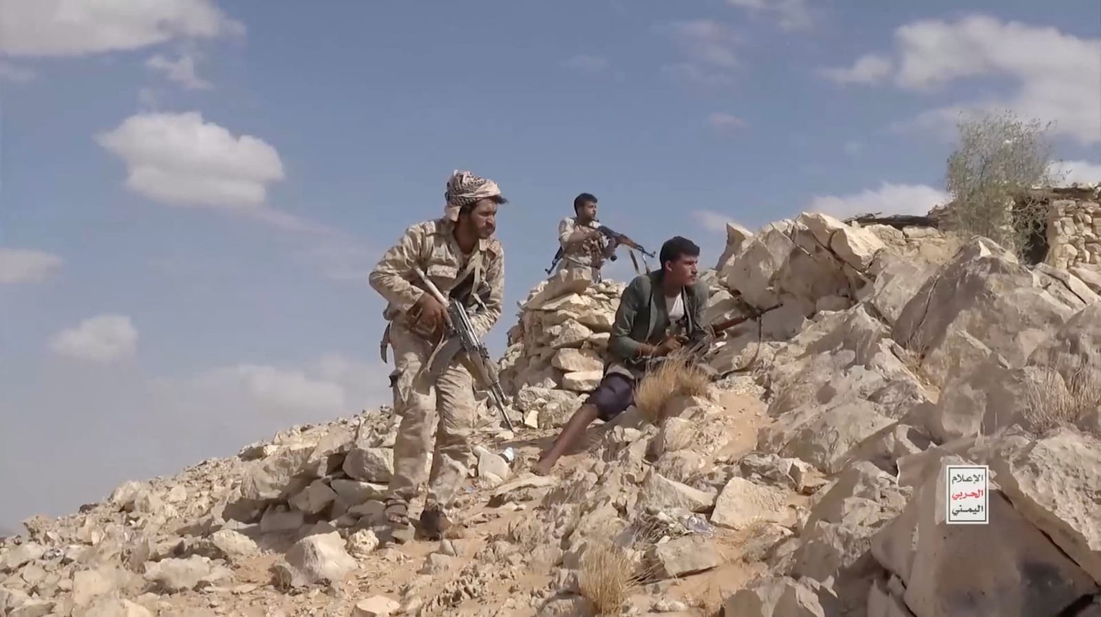 Iran-aligned Houthi fighters occupy a firing position in a screengrab from a video said to show Houthi fighters attacking Saudi-backed forces in the location given by the source as al Jawf governorate, Yemen, in this screengrab taken from a video rel