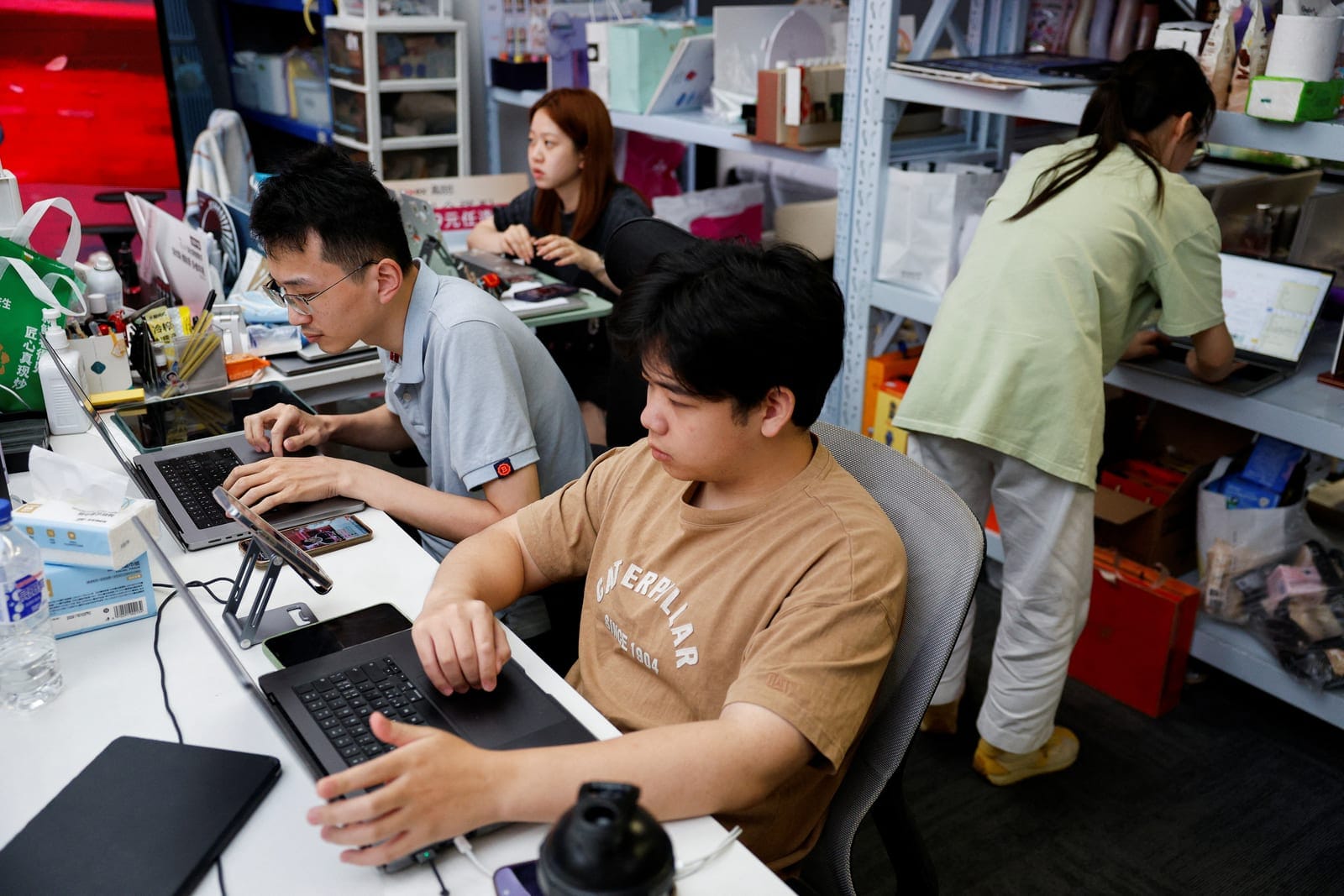 Employees of MeiONE work on computers during a livestream at the company's headquarters in Shanghai, China, September 7, 2026. REUTERS/Go Nakamura