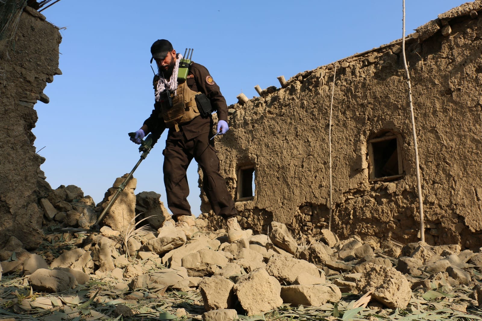 A member of Taliban security forces uses a metal detector amid the rubble of a house that was damaged in what the Taliban said was a Pakistani airstrike in Gurbuz district of Khost province, Afghanistan, September 24, 2026. REUTERS/Stringer