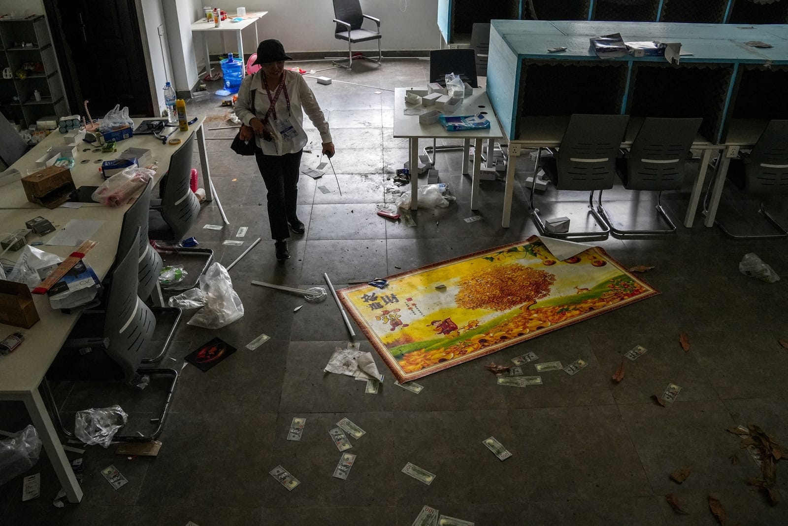 A person walks inside a building of the Legend Innovation Co., Ltd., also known as Meun Chey Commercial City or Legend Park, a site linked to online scam operations and forced labour abuses, in Tbong Wat village, Krabao commune, Komchay Mea district,