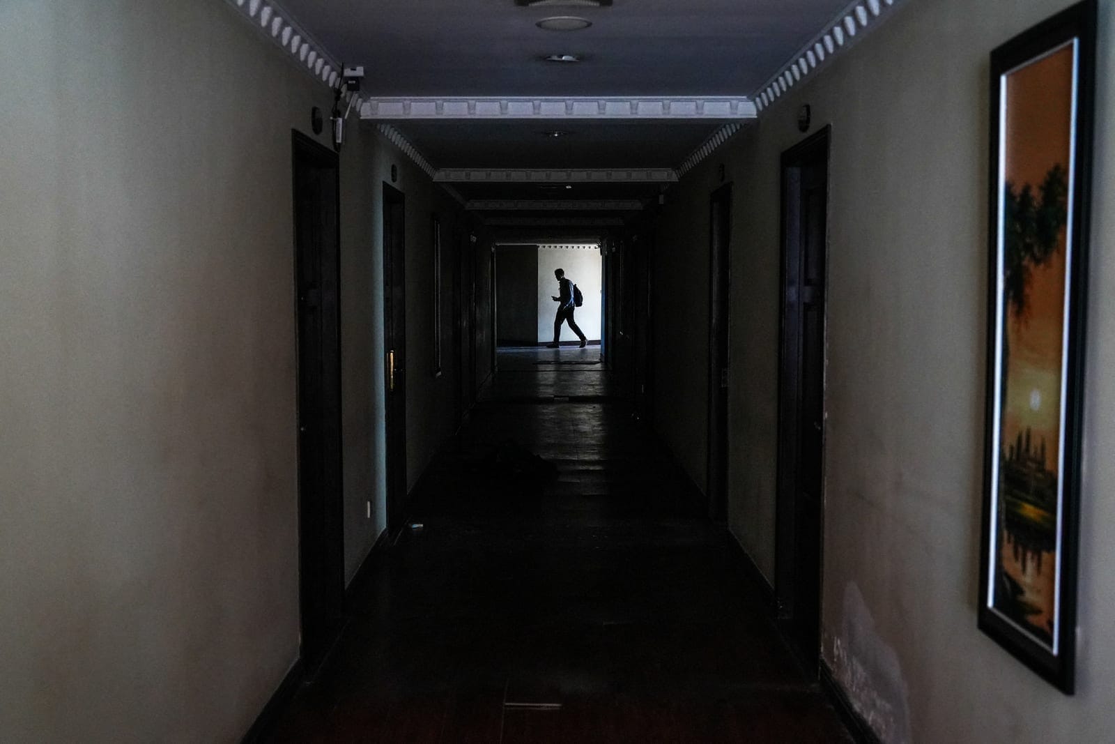A person walks inside Golden Galaxy Casino following an April 7 inspection in which Cambodian authorities said they found online scam operations at the site, in Bavet Kandal village, Bavet commune, Bavet city, Svay Rieng province, Cambodia, September
