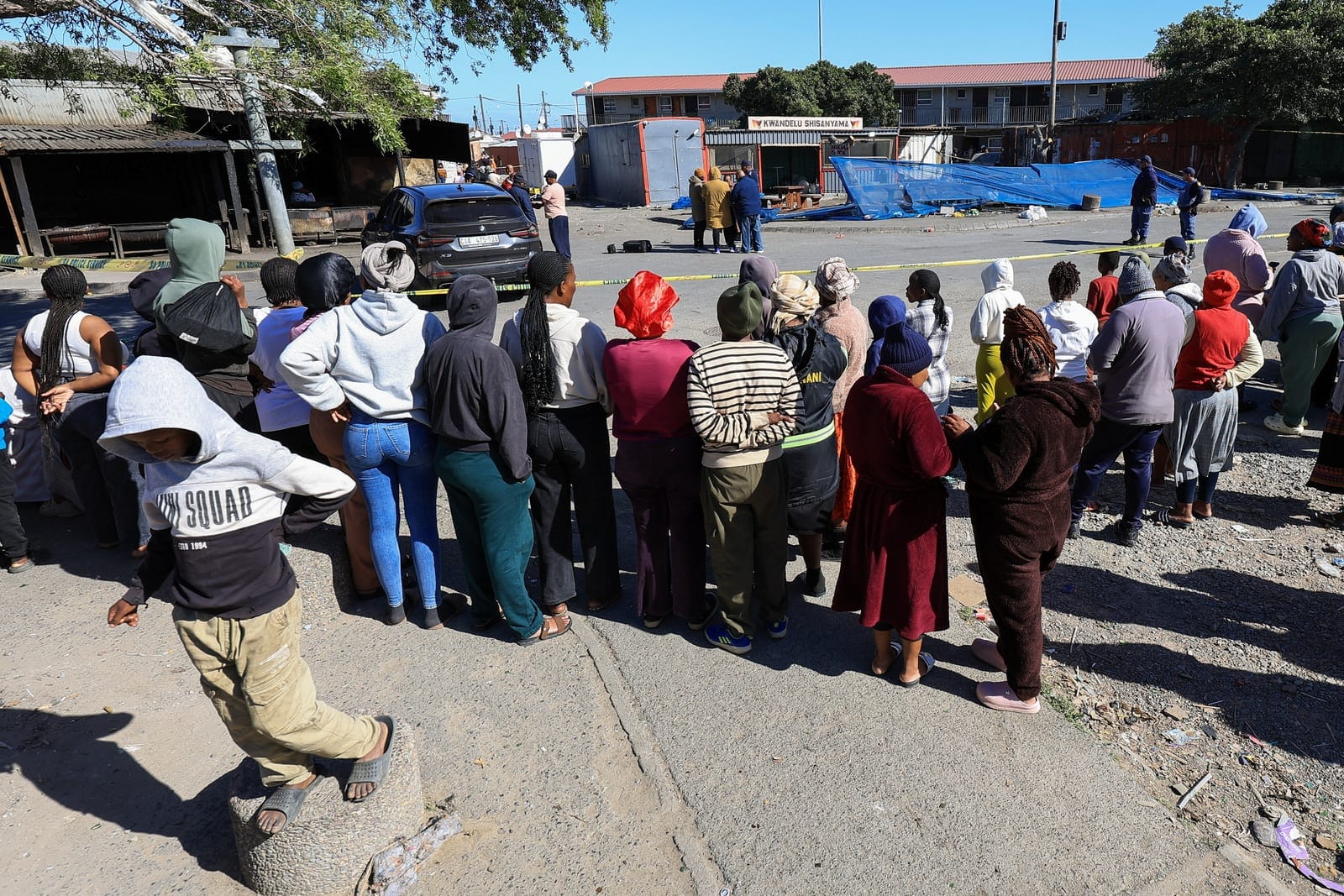 People gather at the site of a shooting in Lwandle in the Western Cape, South Africa, September 27, 2026. REUTERS/Esa Alexander